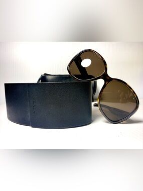 Prada Sunglasses with Tortoiseshell Frames and Two Cases .
